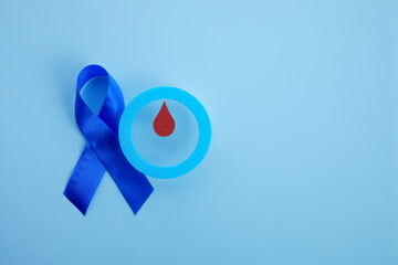 World diabetes day awareness. Blue ribbon and circle with blood drop.