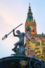 Gdansk, Poland. Statue of Neptune in a fountain, symbol of the city. Town Hall on background. © berezko