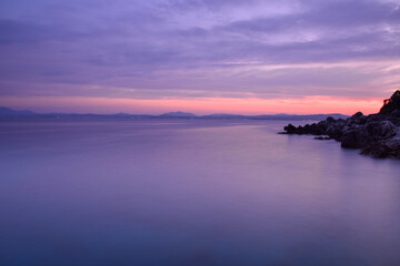 Fototapeta premium Sunset view at coast of Albania, from Corfu island, Ionian sea, Greece