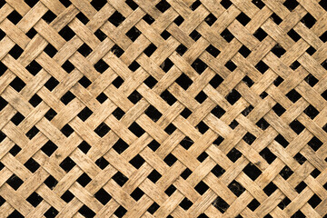 Rustic wooden diagonal lattice. Wood trellis. Wooden netting