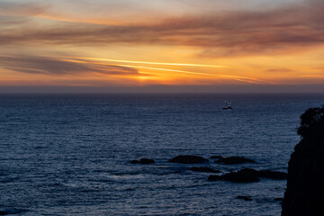 Fototapeta premium Fishing boat at sunset
