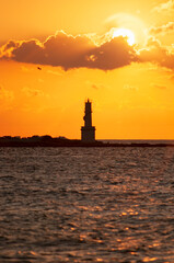 Vertical panoramic view of a lighthouse over the sea at sunset on the island of Formentera in Spain