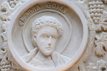 Bas-relief on the wall of the monastery with the image of the apostle