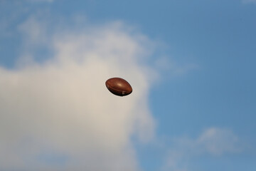 A football travels through the air.