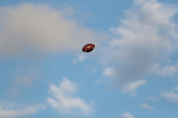 A football travels through the air.