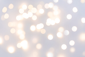 Defocus Christmas lights on a grey background. Copy space