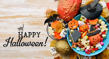 holiday Halloween candy bowl of cookies, candy, chocolates and sweets, Halloween Jack o Lantern - Trick or Treat Halloween card dark background