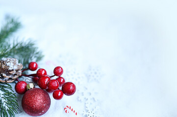 Fir branch with Christmas decorations on white background. Holiday concept.