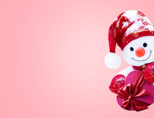 Little snowman in caps and scarfs with gift box. Background with a funny snowman. Christmas card.