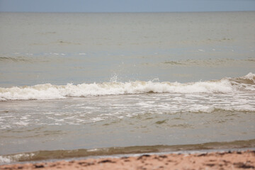 Seascape view of waves in Baltic sea. Photo taken on a warm overcast day.