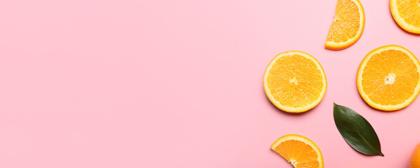 Slices of fresh oranges on color background with space for text