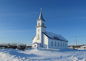 Fototapeta na wymiar Winter postcard with the church and snow