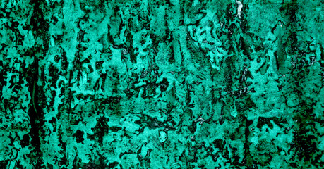 Dark wall surface with turquoise paint