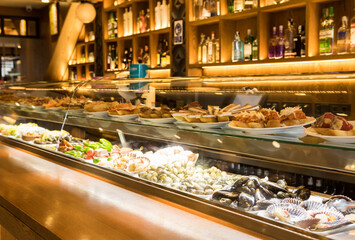 Restaurant showcase of many sorts of tapas