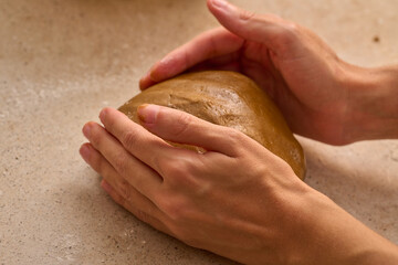 kneading christmas gingerbread man mix with your hands