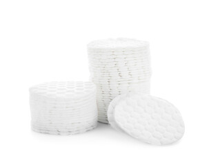Stacks of clean cotton pads isolated on white background