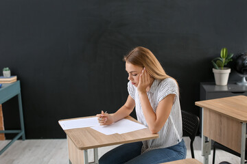 Student passing exam at school