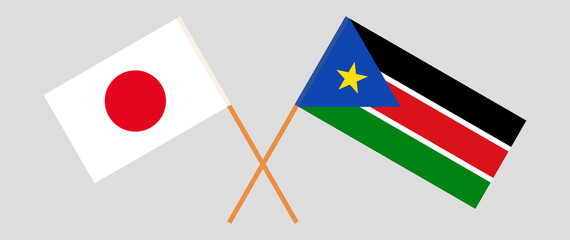Crossed flags of Japan and South Sudan. Official colors. Correct proportion