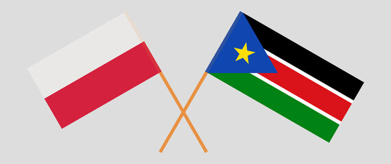 Crossed flags of Poland and South Sudan. Official colors. Correct proportion