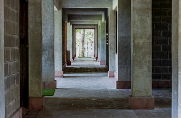 Hallway inside of an old empty building with bright sunlight