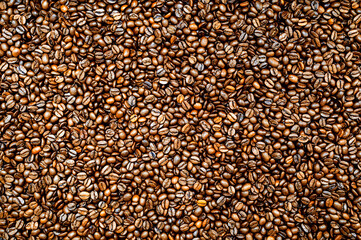 Roasted espresso or coffee beans background. Colorful table top view.