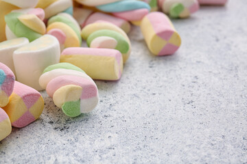 Different pastille marshmallows on light background, closeup