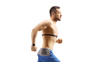 Topless young man running and wearing a chest strap monitor