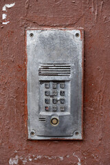 Fototapeta na wymiar old intercom at the entrance to a residential building