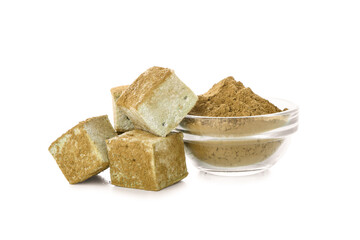 Tasty hojicha marshmallows and powder on white background