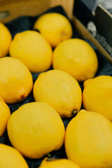 Colorful lemons with stickers at the market