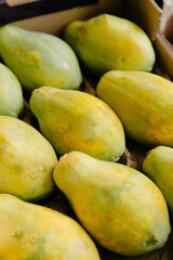 Fresh papayas in a market stall