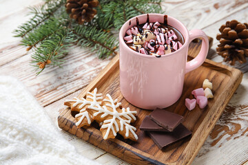 Obraz na płótnie Canvas Cup of tasty hot chocolate with marshmallow and cookies on white wooden background
