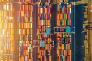 Freight trains from containers at a terminal. Aerial view of container terminal with containers and...