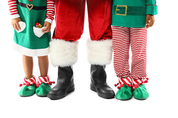 Legs of cute little elves with Santa Claus on white background