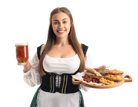 Beautiful Octoberfest waitress with pale beer and food on white background