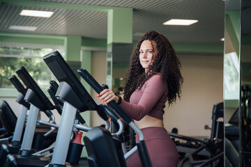 Fototapeta na wymiar Young woman workout in gym healthy lifestyle