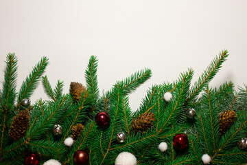 Creative New Year's border from Christmas tree branches. Place for text. Christmas background in retro style. New Year and Christmas card. Nature new year concept. Copy space