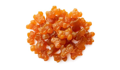 Close-up texture of orange and yellow multivitamin gummies in the form of bears on white background. 