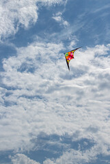 Fototapeta na wymiar Kite flying in the sky with clouds
