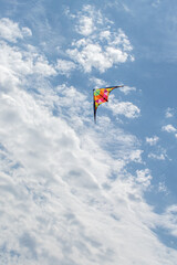 Naklejka na ściany i meble Kite flying in the sky with clouds