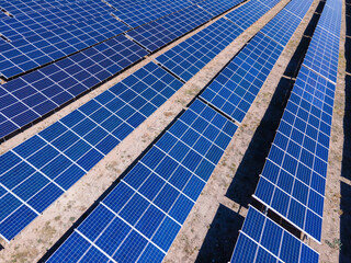 Solar power station with panels standing in rows. Concept of green renewable energy, future technology and innovations