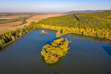 Hungary - Sötétvölgyi lake near Baja city at autumn time and colors from drone view