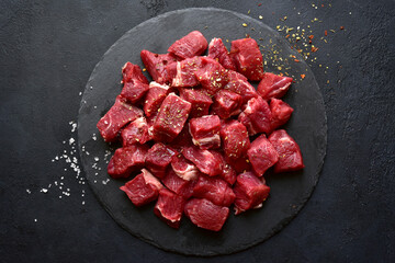 Raw organic meat ( beef or lamb ) . Top view with copy space. - obrazy, fototapety, plakaty
