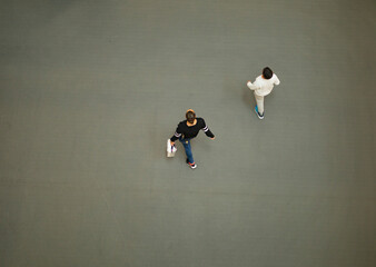 two people shopping walking through a mall overhead view