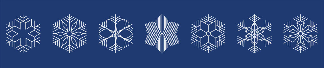 white snowflakes on dark blue background.
