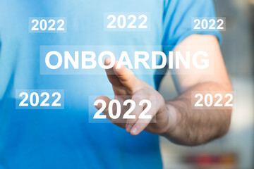 Businessman presses button onboarding process 2022 year business on virtual panel.