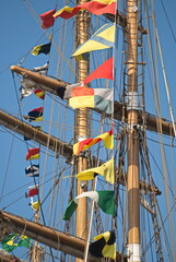 Sailing ship with many little flags. 
