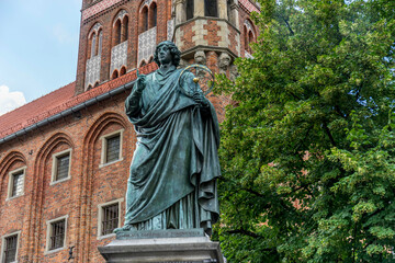 The Nicolaus Copernicus Monument in Torun - home town of astronomer Nicolaus Copernicus. Statue in front of the Old Town Hall, Torun, Poland.