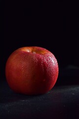 Fototapeta na wymiar Close-up photo of fresh apples on a dark background, still life photography 