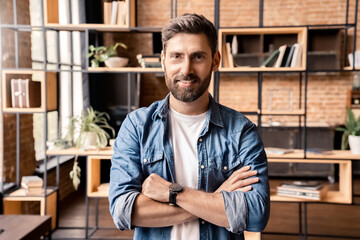 Businessman freelancer standing with arms crossed on chest headshot portrait